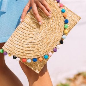 Francesca’s Rainbow pompom straw clutch NWT